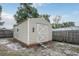 Tan storage shed with double doors and window at 2473 Barbarossa, Deltona, FL 32738