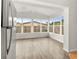 Sunroom addition with multiple windows and vinyl flooring at 2473 Barbarossa, Deltona, FL 32738