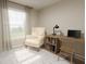Bright bedroom with desk, chair and large window at 305 Wharf Way, Winter Haven, FL 33881
