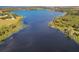 Expansive aerial view of a lake and surrounding landscape at 309 W Frederick Ave, Dundee, FL 33838