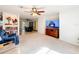 Spacious living room featuring a large TV and ample seating at 309 W Frederick Ave, Dundee, FL 33838