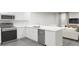 Modern kitchen with stainless steel appliances and island at 309 Wharf Way, Winter Haven, FL 33881