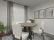 Cozy dining area with a round wooden table and four white chairs at 313 Wharf Way, Winter Haven, FL 33881