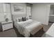 Spacious main bedroom with a plush bed, nightstands, and window coverings at 313 Wharf Way, Winter Haven, FL 33881
