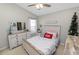 Bedroom with a queen-size bed and dresser at 7185 Cedarcrest Blvd, Lakeland, FL 33810