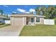 Cute newly built home with a one-car garage and small front yard at 1211 Josephine St, Lakeland, FL 33815