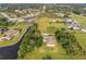 Aerial view of property highlighting waterfront location at 1730 Broken Arrow N Trl, Lakeland, FL 33813