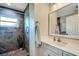 Updated bathroom with walk-in shower and modern vanity at 1730 Broken Arrow N Trl, Lakeland, FL 33813