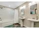 Bathroom with double vanity, shower/tub combo, and updated fixtures at 1730 Broken Arrow N Trl, Lakeland, FL 33813