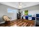 Bright bedroom with wood flooring and ceiling fan at 1730 Broken Arrow N Trl, Lakeland, FL 33813