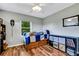 Bedroom with wood flooring, ceiling fan, and ample closet space at 1730 Broken Arrow N Trl, Lakeland, FL 33813