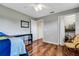 Bedroom with wood flooring, ceiling fan, and walk-in closet at 1730 Broken Arrow N Trl, Lakeland, FL 33813
