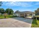 Covered carport with concrete driveway and grassy yard at 1730 Broken Arrow N Trl, Lakeland, FL 33813