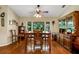 Charming dining room with hardwood floors and wooden hutch at 1730 Broken Arrow N Trl, Lakeland, FL 33813