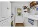 Laundry room with washer, dryer, and ample storage at 1730 Broken Arrow N Trl, Lakeland, FL 33813