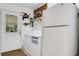 Bright laundry room with washer, dryer, and exterior access at 1730 Broken Arrow N Trl, Lakeland, FL 33813