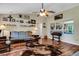 Bright living room with hardwood floors, vaulted ceilings and large windows at 1730 Broken Arrow N Trl, Lakeland, FL 33813