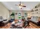 Comfortable living room with hardwood floors, and access to backyard at 1730 Broken Arrow N Trl, Lakeland, FL 33813