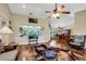 Open concept living room with hardwood floors and views to the dining area at 1730 Broken Arrow N Trl, Lakeland, FL 33813