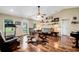 Spacious living room featuring hardwood floors and a cozy sitting area at 1730 Broken Arrow N Trl, Lakeland, FL 33813