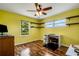 Bright office with wood flooring, ceiling fan, and window views at 1730 Broken Arrow N Trl, Lakeland, FL 33813