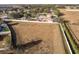 Aerial view of vacant lot, next to houses and farmland at 1918 Wind Meadows Dr, Bartow, FL 33830