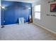 Bedroom with blue accent wall and floor lamps at 1918 Wind Meadows Dr, Bartow, FL 33830