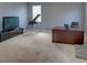Home office features desk, TV, and exercise equipment at 1918 Wind Meadows Dr, Bartow, FL 33830