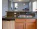 Kitchen with granite countertops, stainless steel sink and dishwasher at 1918 Wind Meadows Dr, Bartow, FL 33830