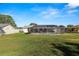 Spacious backyard with large screened pool and patio area at 227 Ridgedale Dr, Lakeland, FL 33809
