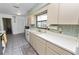 Galley kitchen with stainless steel appliances and ample counter space at 227 Ridgedale Dr, Lakeland, FL 33809