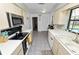 Efficient kitchen with stainless steel appliances and view of pool at 227 Ridgedale Dr, Lakeland, FL 33809