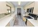 Bright kitchen features stainless steel appliances and ample counter space at 227 Ridgedale Dr, Lakeland, FL 33809