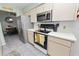 Modern kitchen with stainless steel appliances and light cabinetry at 227 Ridgedale Dr, Lakeland, FL 33809