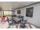 Screened patio with table and chairs, perfect for outdoor dining at 227 Ridgedale Dr, Lakeland, FL 33809