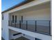 Covered balcony with modern metal railing offers scenic views at 2728 Sunrise Landing Ln, Lakeland, FL 33812