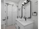 Contemporary bathroom with white vanity and barn door at 2728 Sunrise Landing Ln, Lakeland, FL 33812