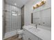 Modern bathroom with patterned tile shower and updated vanity at 2728 Sunrise Landing Ln, Lakeland, FL 33812
