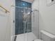 Updated bathroom featuring a walk-in shower with herringbone tile at 2728 Sunrise Landing Ln, Lakeland, FL 33812