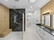 Elegant bathroom boasts a large shower, double vanity, and plenty of light at 2728 Sunrise Landing Ln, Lakeland, FL 33812