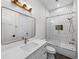 Modern bathroom with hexagon tile and gold fixtures at 2728 Sunrise Landing Ln, Lakeland, FL 33812