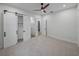 Bedroom with ceiling fan and barn doors leading to closet and bath at 2728 Sunrise Landing Ln, Lakeland, FL 33812