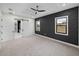 Bright bedroom featuring a barn door to the ensuite bathroom and walk-in closet at 2728 Sunrise Landing Ln, Lakeland, FL 33812