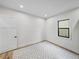 Spacious bedroom with hardwood floors and a large window at 2728 Sunrise Landing Ln, Lakeland, FL 33812