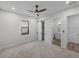 Spacious bedroom with ceiling fan and access to bathroom at 2728 Sunrise Landing Ln, Lakeland, FL 33812