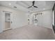 Bedroom with access to bathroom and kitchen, carpeted floor, and high ceilings at 2728 Sunrise Landing Ln, Lakeland, FL 33812