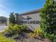 Sunrise Landing community entrance with signage and landscaping at 2728 Sunrise Landing Ln, Lakeland, FL 33812