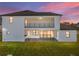 Modern two-story home with balcony and backyard patio at 2728 Sunrise Landing Ln, Lakeland, FL 33812