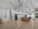 Modern kitchen features island, stainless steel appliances, and hardwood floors at 2728 Sunrise Landing Ln, Lakeland, FL 33812