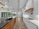 Modern kitchen with white cabinets, wood island, and high-end appliances at 2728 Sunrise Landing Ln, Lakeland, FL 33812